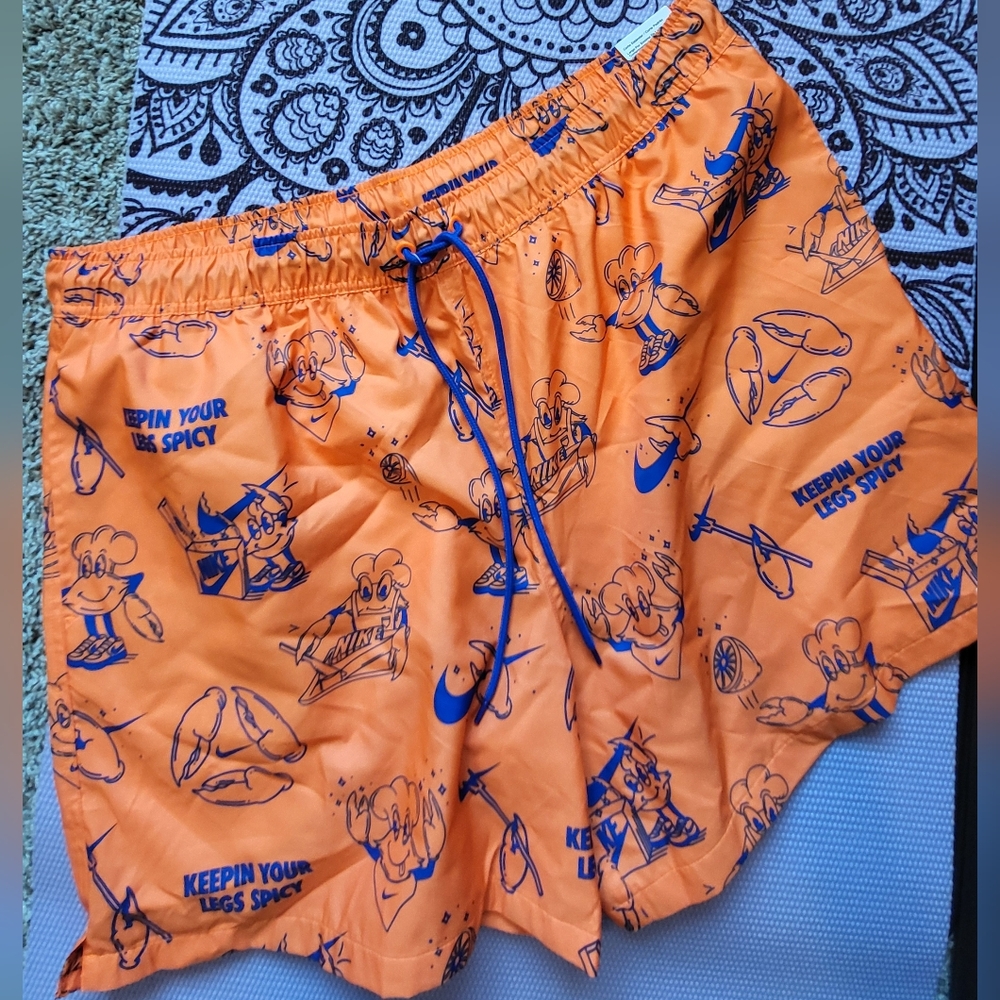 Bright Orange Swim Shorts with Blue Graphics